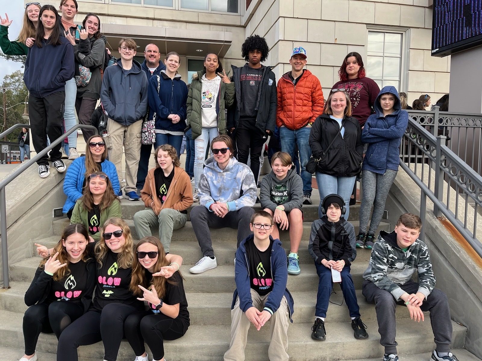 A picture of the NEUMC youth group on the steps outside Township Auditorium, taken during Revolution 2024.